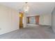 Cozy living room featuring a decorative light fixture and carpet flooring throughout at 8413 Lincolnshire Dr, Hudson, FL 34667