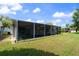 Spacious screened-in porch offers an ideal space for outdoor enjoyment and relaxation at 8413 Lincolnshire Dr, Hudson, FL 34667