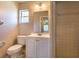 This bathroom features a shower stall, vanity sink, and a white ceramic tile surround at 8730 Filson Pl, Sarasota, FL 34231