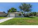 Charming single-story home featuring a well-maintained lawn, attached garage and tasteful landscaping at 8730 Filson Pl, Sarasota, FL 34231