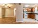 Open floor plan showcasing the living room and kitchen with modern appliances and wood cabinets at 8730 Filson Pl, Sarasota, FL 34231