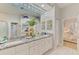Bathroom boasts dual sinks with granite counters and a large mirror at 8731 52Nd E Dr, Bradenton, FL 34211