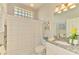 Well-lit bathroom features a shower-tub combination and neutral decor at 8731 52Nd E Dr, Bradenton, FL 34211