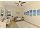 A bedroom is furnished with a comfortable sitting area and vanity at 8731 52Nd E Dr, Bradenton, FL 34211