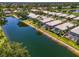 Aerial view showcasing waterfront homes, each featuring a screened-in pool and lush landscaping at 8731 52Nd E Dr, Bradenton, FL 34211