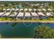 Aerial view of the residential community featuring waterfront properties with pools at 8731 52Nd E Dr, Bradenton, FL 34211