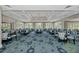 Elegant dining room with decorative carpet, ample seating, and large windows overlooking the grounds at 8731 52Nd E Dr, Bradenton, FL 34211