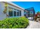 Landscaped yard with well-maintained greenery and a view of the screened-in pool area at 8731 52Nd E Dr, Bradenton, FL 34211