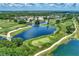Scenic aerial view of the meticulously maintained golf course with water features and lush greenery at 8731 52Nd E Dr, Bradenton, FL 34211