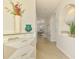 Bright hallway with decorative shelving, archways and sightlines to the dining and living room at 8731 52Nd E Dr, Bradenton, FL 34211