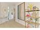 Inviting hallway with elegant decor, artwork, and decorative shelving at 8731 52Nd E Dr, Bradenton, FL 34211