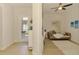 Bright living room featuring wood floors, ceiling fan, modern decor, and a view of the entryway at 8731 52Nd E Dr, Bradenton, FL 34211