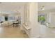 Bright, open floor plan with living and dining areas, featuring wood floors and modern furnishings at 8731 52Nd E Dr, Bradenton, FL 34211
