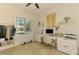 Bright office space with a desk and an organized wardrobe area at 8731 52Nd E Dr, Bradenton, FL 34211