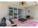 Covered patio with ceiling fan, comfortable seating, and view of the backyard at 8731 52Nd E Dr, Bradenton, FL 34211