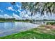 Scenic pond with a wooden bridge and lush green surroundings, perfect for a relaxing walk at 8731 52Nd E Dr, Bradenton, FL 34211