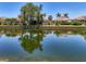 Reflective water view showcasing waterfront homes and lush landscaping at 8731 52Nd E Dr, Bradenton, FL 34211