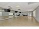 Bright and spacious yoga room featuring a large mirror, hardwood floors, and a serene atmosphere at 8731 52Nd E Dr, Bradenton, FL 34211