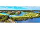 Aerial view of a community surrounding a golf course and waterways at 9635 Discovery Ter, Bradenton, FL 34212