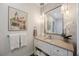 Stylish powder room with a modern vanity, pendant lighting, and decorative wall accents at 9635 Discovery Ter, Bradenton, FL 34212