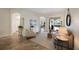 Inviting living room with comfortable seating, arched doorways, and a view of the screened outdoor area at 9635 Discovery Ter, Bradenton, FL 34212