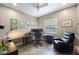 Home office with natural light and comfortable seating at 9635 Discovery Ter, Bradenton, FL 34212