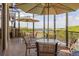 Relaxing enclosed patio with tables and chairs, perfect for enjoying the view at 9635 Discovery Ter, Bradenton, FL 34212