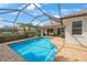 Backyard pool featuring beautiful screen enclosure at 9635 Discovery Ter, Bradenton, FL 34212