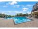 View of the Waterlefe Golf & River Club pool with lounge chairs and umbrellas at 9635 Discovery Ter, Bradenton, FL 34212