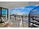 Balcony with ocean views, seating, and spiral staircase access to the rooftop at 103 4Th N St # A, Bradenton Beach, FL 34217