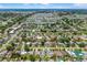 Drone shot of house in residential area with view of local cityscape, trees, and streets at 1040 Hope St, Venice, FL 34285