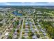Neighborhood aerial view with lake and green spaces showing a desirable community at 1040 Hope St, Venice, FL 34285