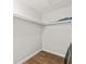 Walk-in closet with shelves and rod for optimal storage solutions at 1040 Hope St, Venice, FL 34285