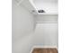 Walk-in closet offering ample storage with rods and shelves at 1040 Hope St, Venice, FL 34285