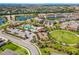 Aerial view of the community showcasing the pool, playground, and landscaping at 11411 Spring Gate Trl, Bradenton, FL 34211