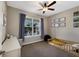 Neutral toned bedroom with a ceiling fan and a bright window at 11411 Spring Gate Trl, Bradenton, FL 34211