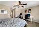 Bedroom space with a ceiling fan, desk, chair, and carpet flooring at 11411 Spring Gate Trl, Bradenton, FL 34211
