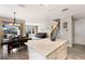Open-concept kitchen with a large island, connecting to the dining area and living room, with views of the pool at 11411 Spring Gate Trl, Bradenton, FL 34211