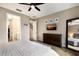 Spacious main bedroom with a dresser, mounted TV, and en-suite bath at 11411 Spring Gate Trl, Bradenton, FL 34211