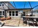 Relaxing enclosed patio with outdoor television, seating, bar and barbecue area at 11411 Spring Gate Trl, Bradenton, FL 34211