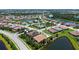 Aerial view of a neighborhood featuring landscaped streets and community lakes at 11603 Bluebird Pl, Lakewood Ranch, FL 34211