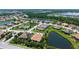 Beautiful aerial view of the neighborhood showing community pool, lakes and beautiful homes at 11603 Bluebird Pl, Lakewood Ranch, FL 34211