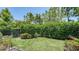 Well-maintained backyard featuring lush greenery and a neat garden at 11603 Bluebird Pl, Lakewood Ranch, FL 34211