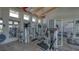 Modern gym with weight machines, full mirrors, and fitness equipment for a complete workout experience at 11603 Bluebird Pl, Lakewood Ranch, FL 34211