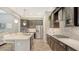Spacious kitchen featuring modern appliances, sleek cabinetry, and a large center island with seating at 11603 Bluebird Pl, Lakewood Ranch, FL 34211