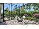 Inviting screened patio with comfortable seating and a charming fire pit for cozy evenings at 11603 Bluebird Pl, Lakewood Ranch, FL 34211