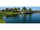 Calm pond reflecting the community, providing a tranquil backdrop with lush landscaping and waterfront amenities at 11603 Bluebird Pl, Lakewood Ranch, FL 34211