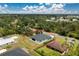 An aerial view shows this beautifully constructed home with a well maintained yard and a serene surrounding neighborhood at 11960 De Leon Dr, North Port, FL 34287
