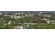 See the neighborhood, landscaping, yards, and surrounding area of the house from this high angle aerial image at 11960 De Leon Dr, North Port, FL 34287