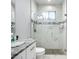 This bathroom showcases a granite vanity and a glass-enclosed shower with sleek fixtures at 11960 De Leon Dr, North Port, FL 34287